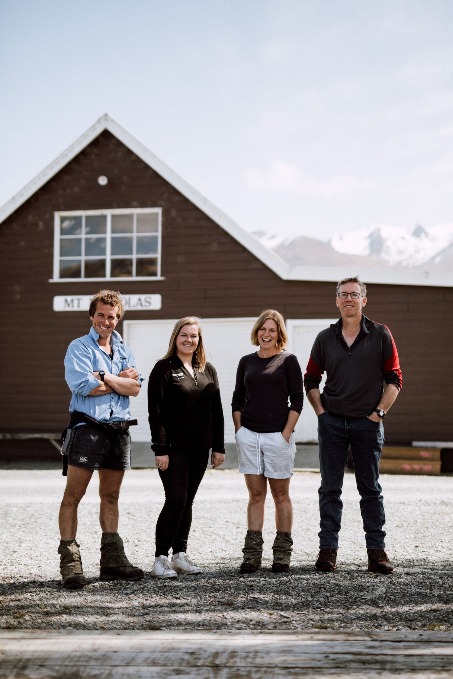 Mount Nicholas Merino founders Kate, Jack, Phil and Latisha standing infront of farm buildings.
